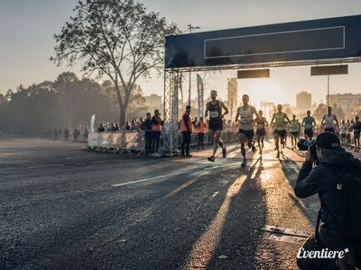 Runners approaching the finish line at a city marathon